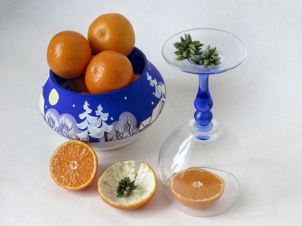Tangerines in a blue vase