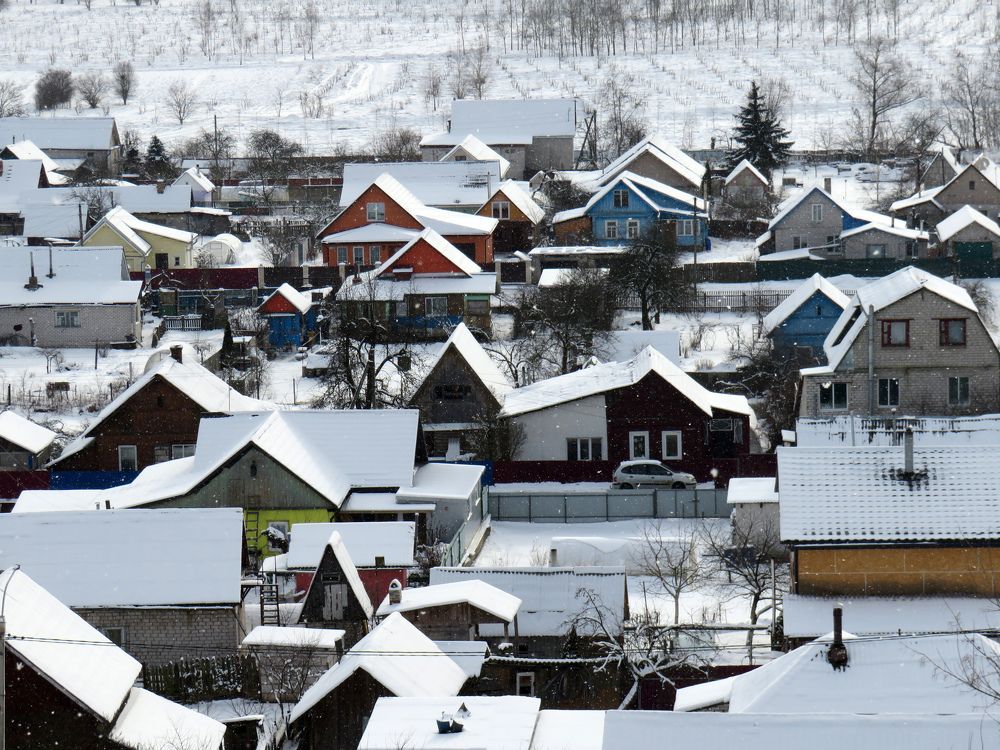 Snow-covered houses in the city
