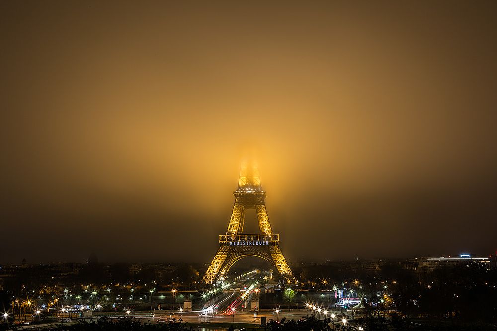 Eiffel Tower being swallowed by the fog..