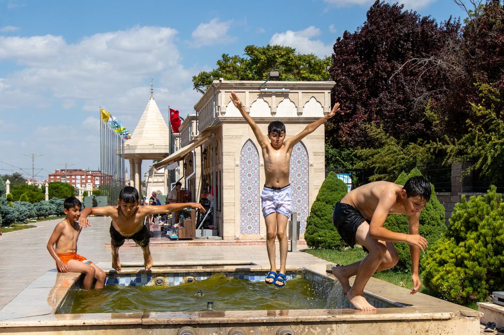 Happy children swimming in fountain