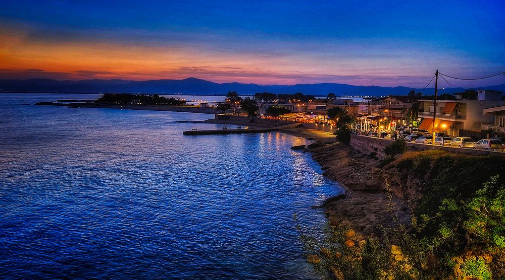 coast and beach at the port of Fanari, Greece, during the blue hour