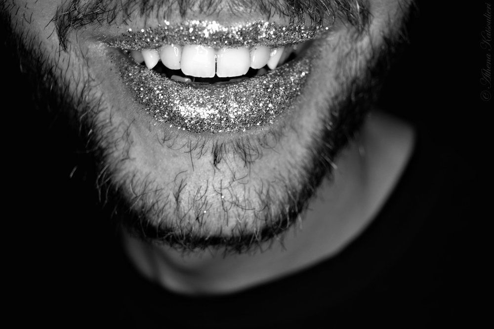 Lips break in a smile, taste of joy for a while