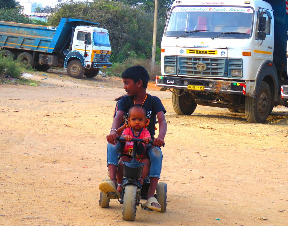 Random boy playing with a younger boy