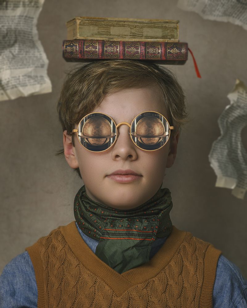 Boy with glasses and books
