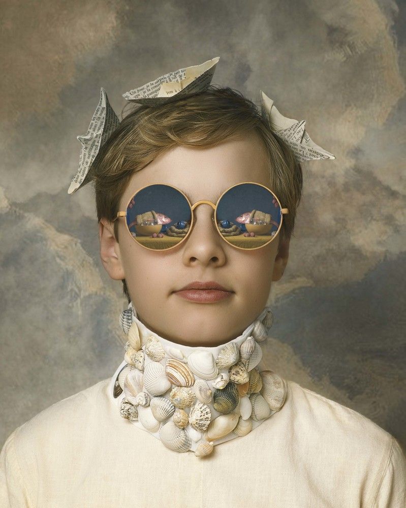 Boy with glasses and sea