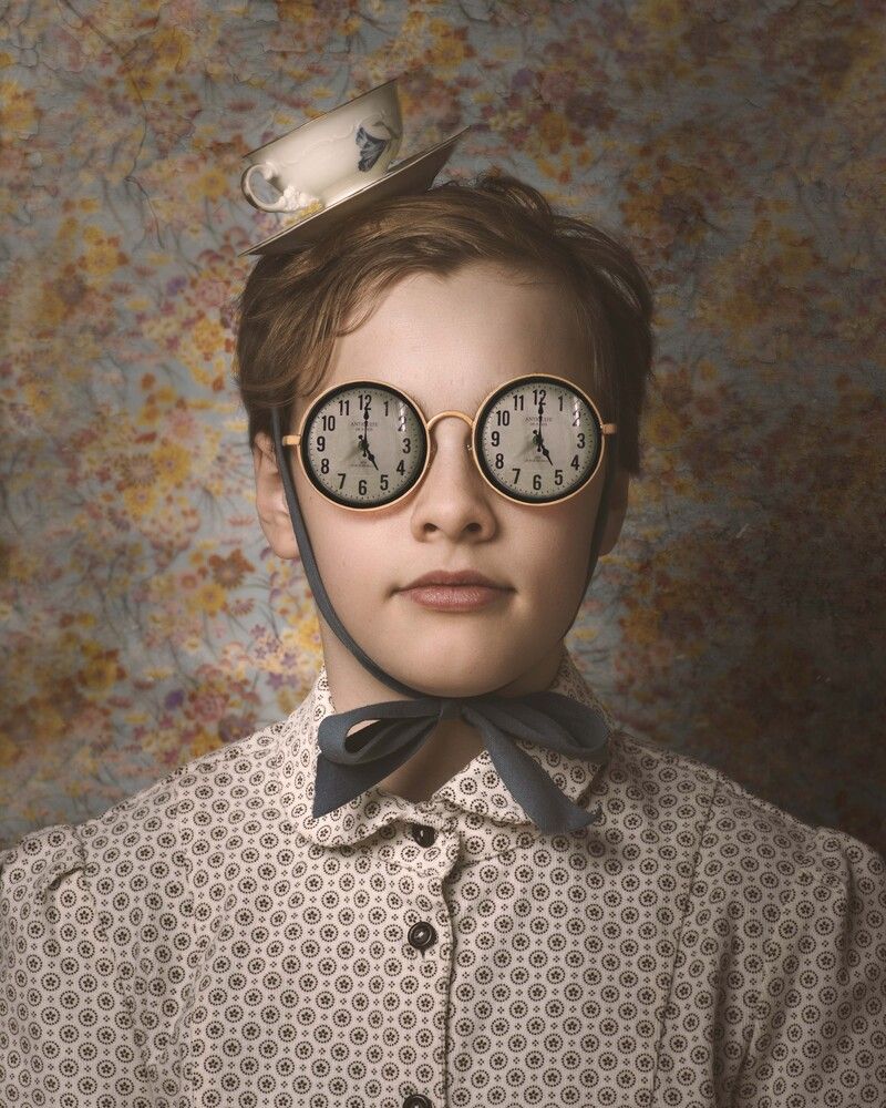 Boy with glasses and tea at five