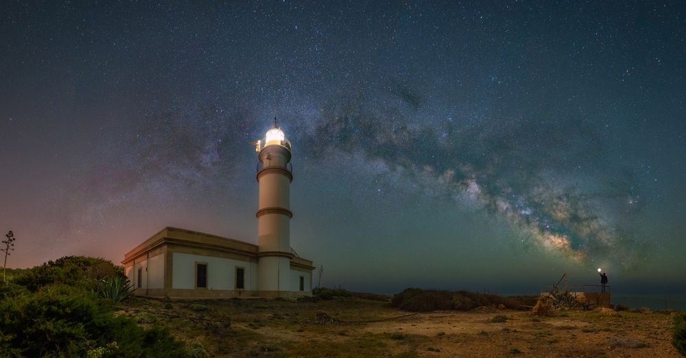 Full galactic arc over the Ses Salines lighthouse