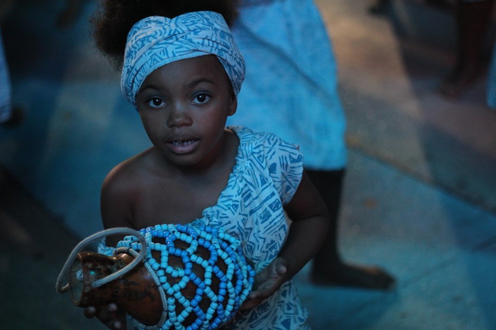 The girl with magic eyes in the multicultural carnival