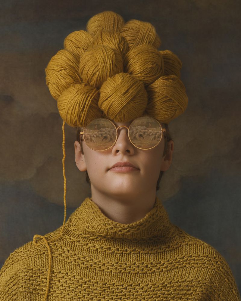 Boy with glasses and sheep