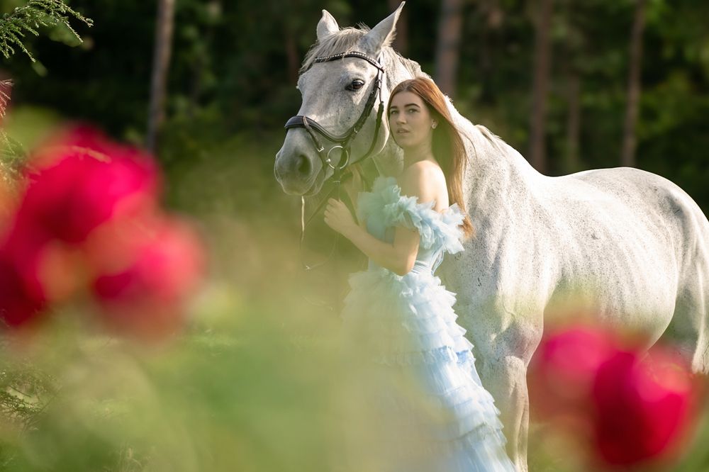 Nikol in a fairytale forest with horses
