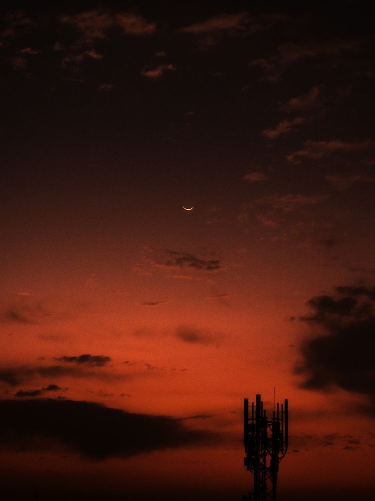 Whispers of Night: A Crescent Moon\'s Embrace\"