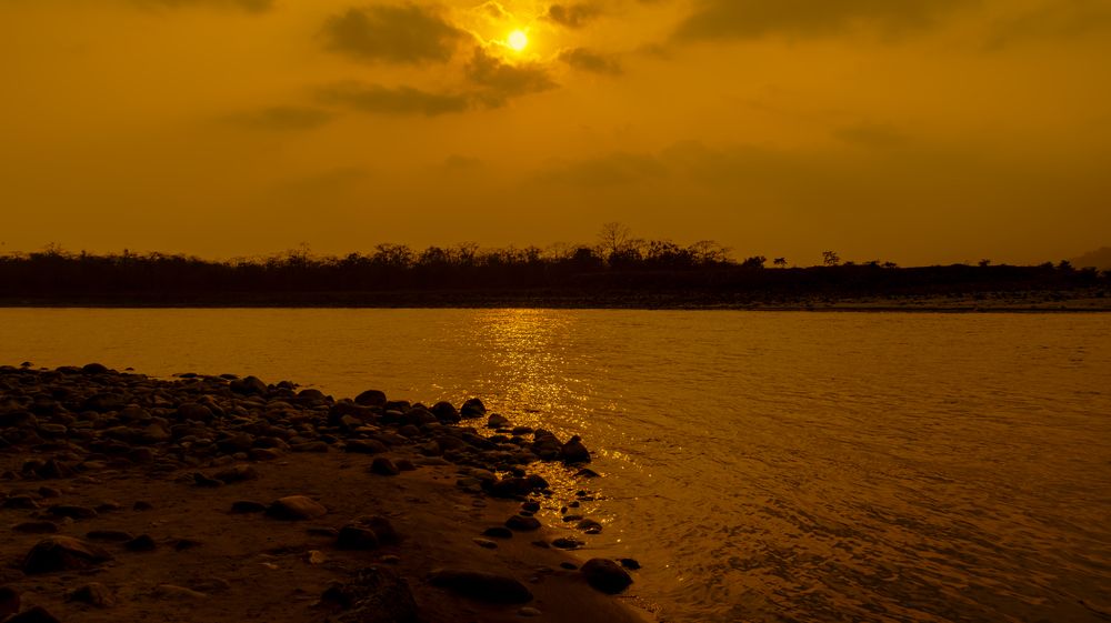 Fiery Serenity: A Sunset by the River