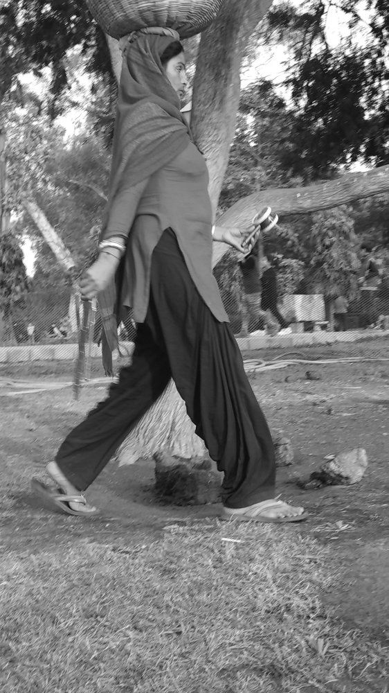Woman holding basket with a toy in hand