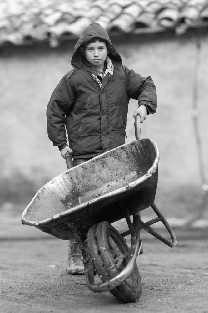 child with wheelbarrow