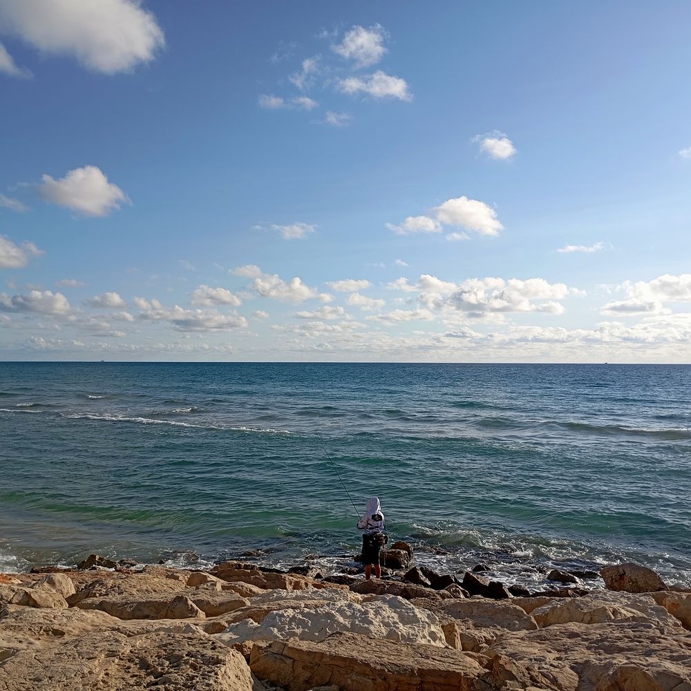 Fisherman on the rocks.