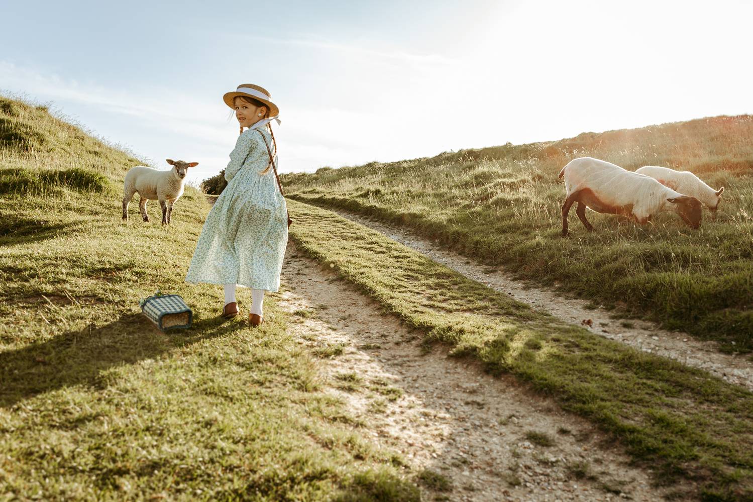 Just a girl and her sheep, soaking up the sunshine. Just a girl and her sheep, soaking up the sunshine.