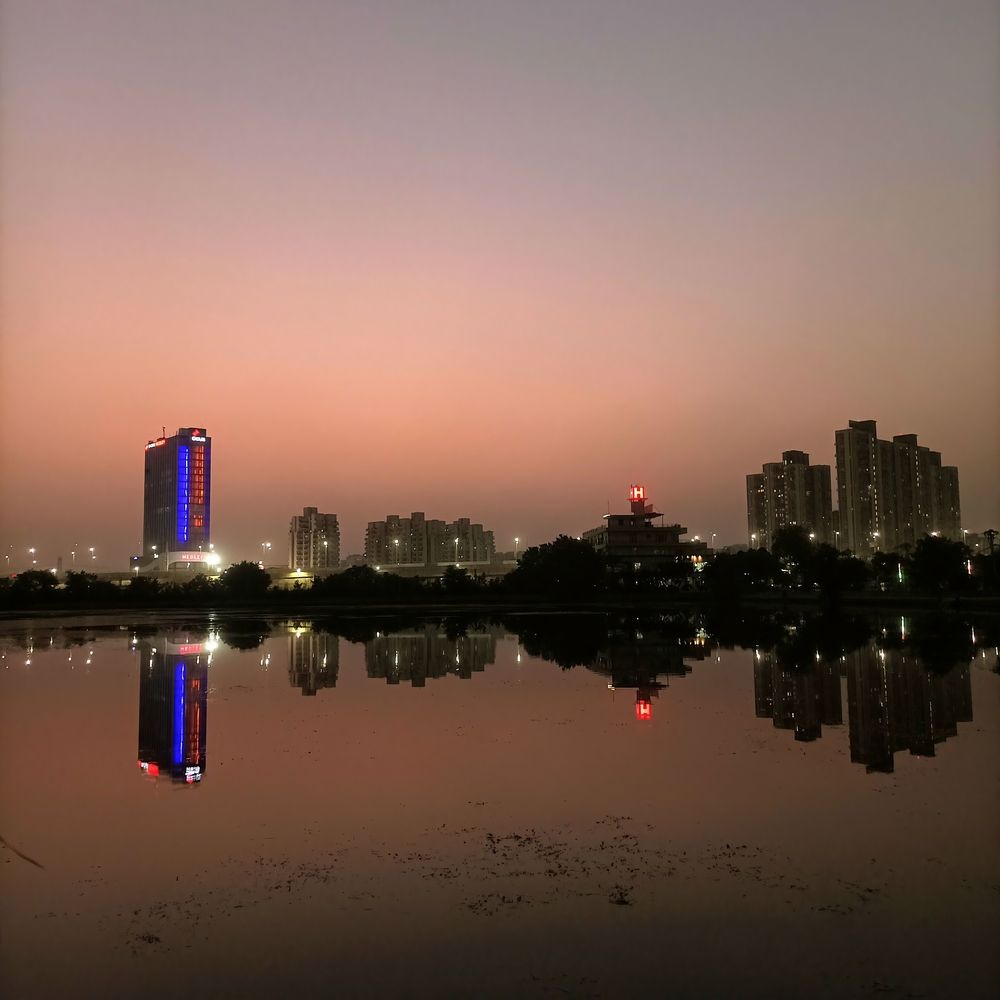 Twilight Reflections | City Lights Meet Still Waters at Dusk