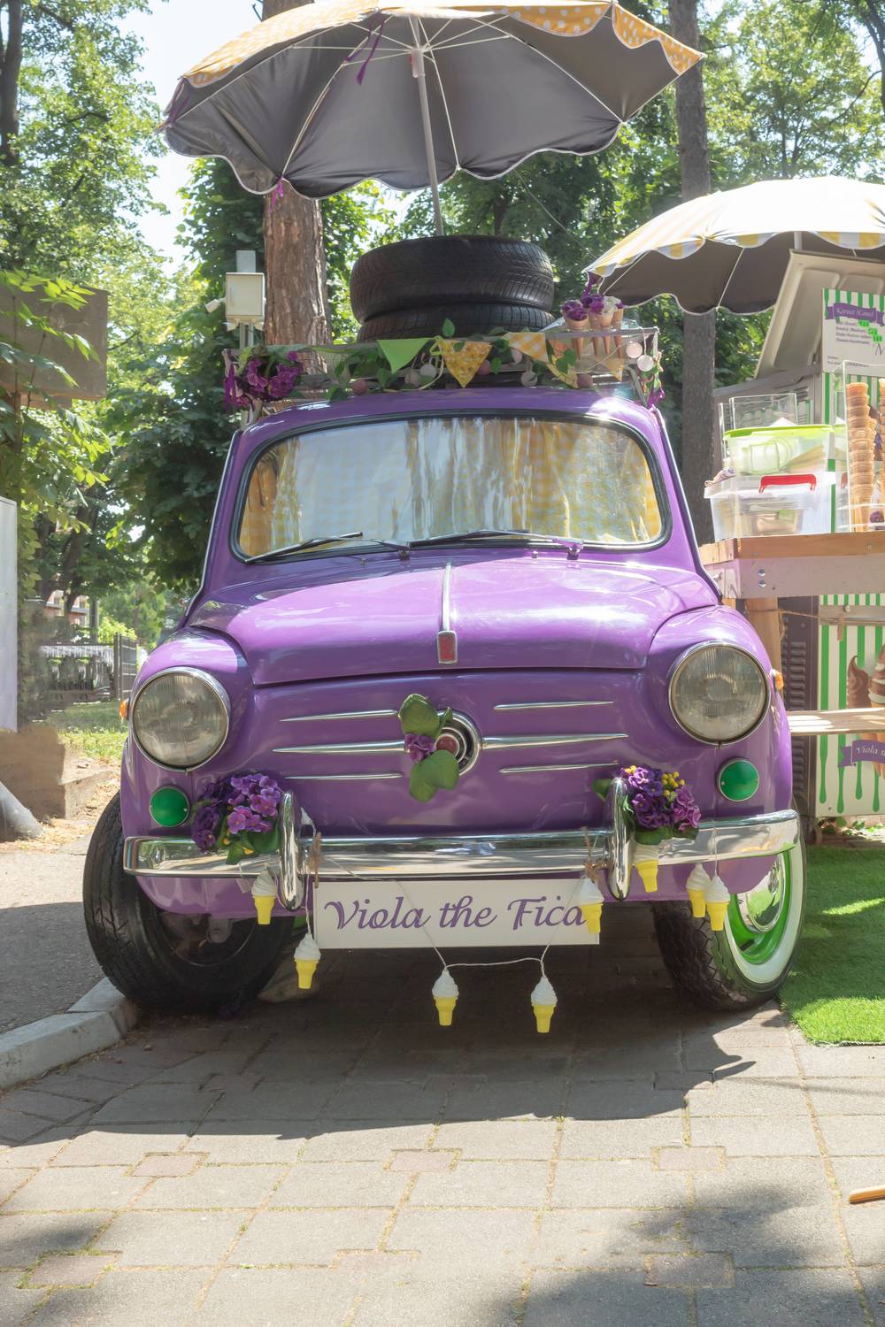 Purple retro car in the park, sunny day