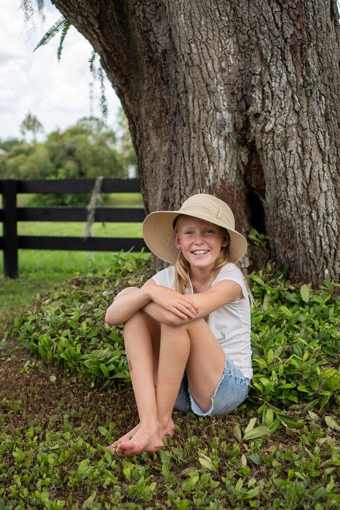 The girl in her mom`s hat