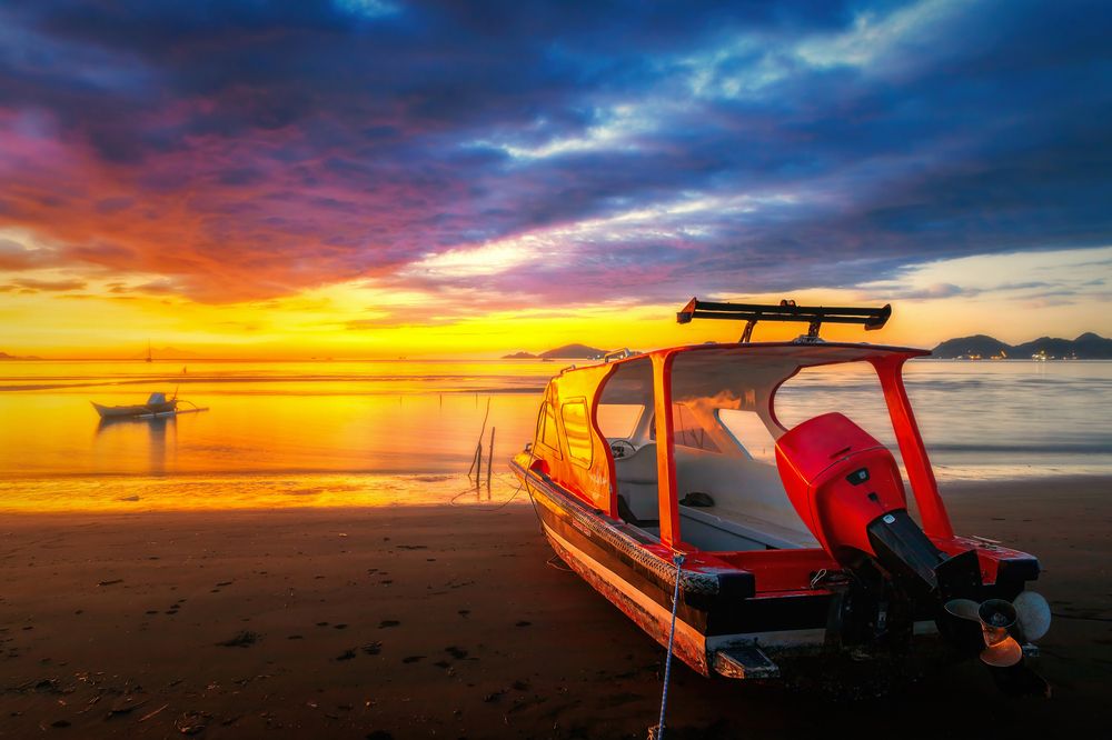 Red speedboat on the beach