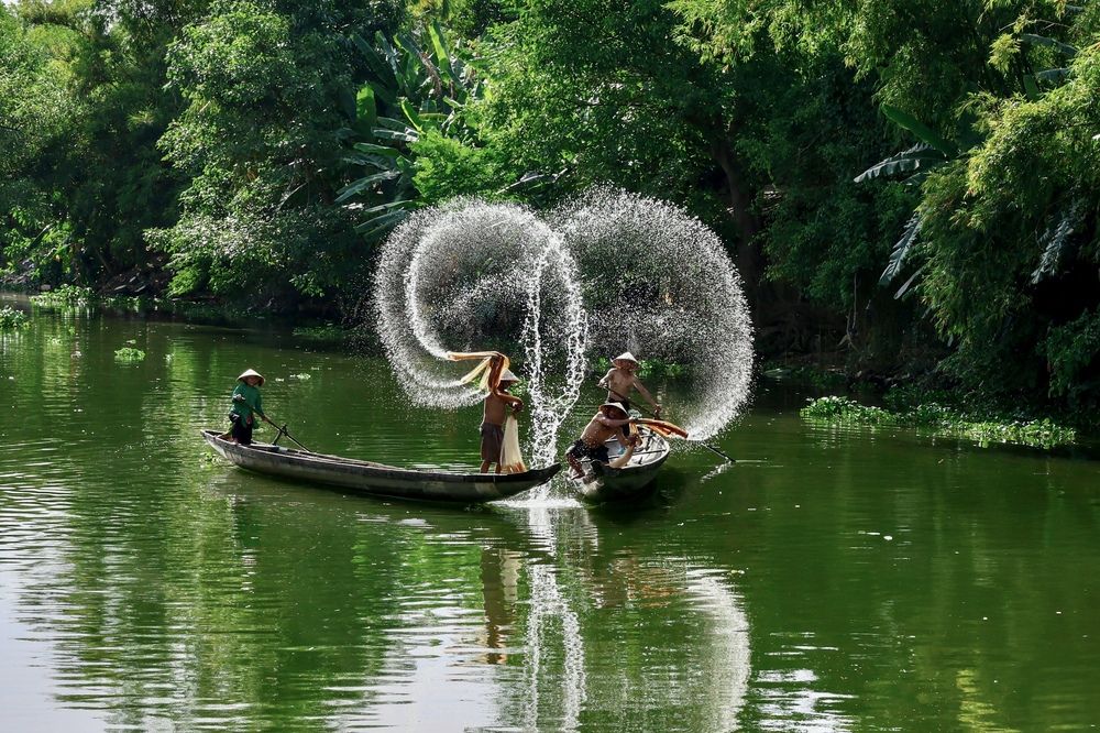 Fishermen on the River in Hue
