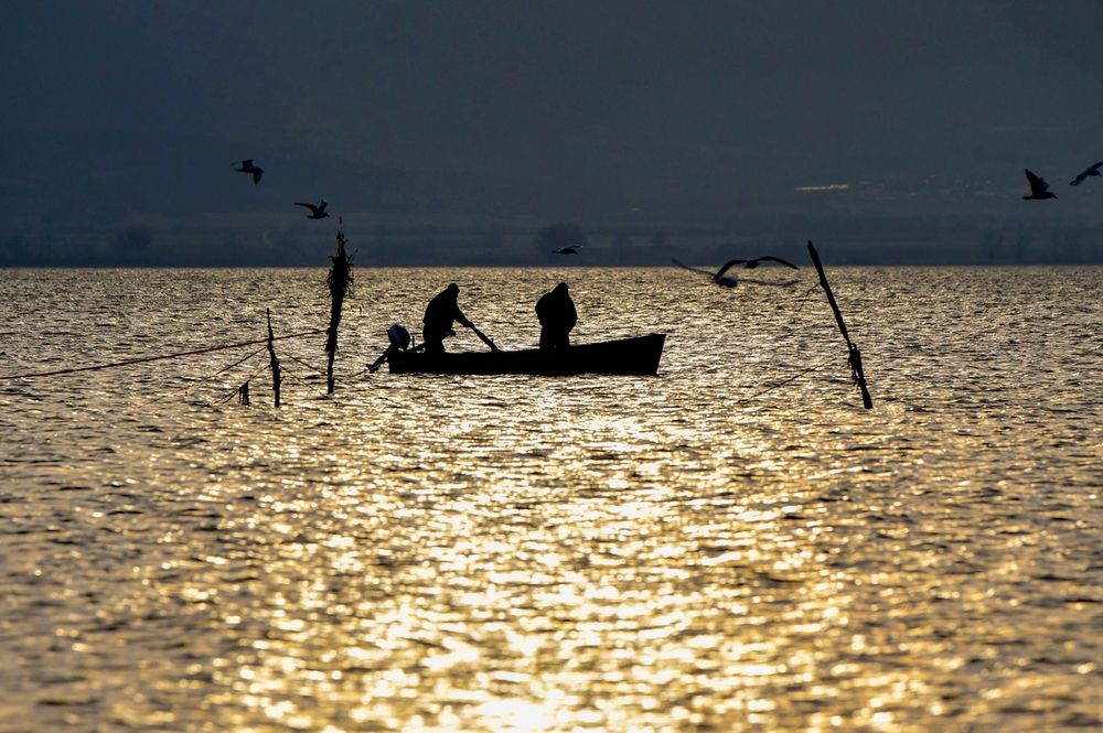 Silhouette of fisherman on lake Dojran