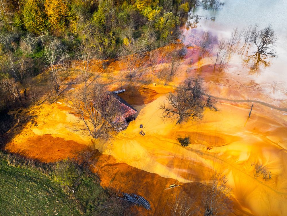Village submerged in wasteland