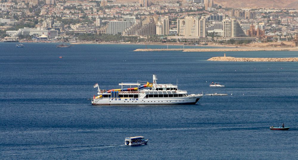 A tourist boat stands in the Gulf of Aqaba