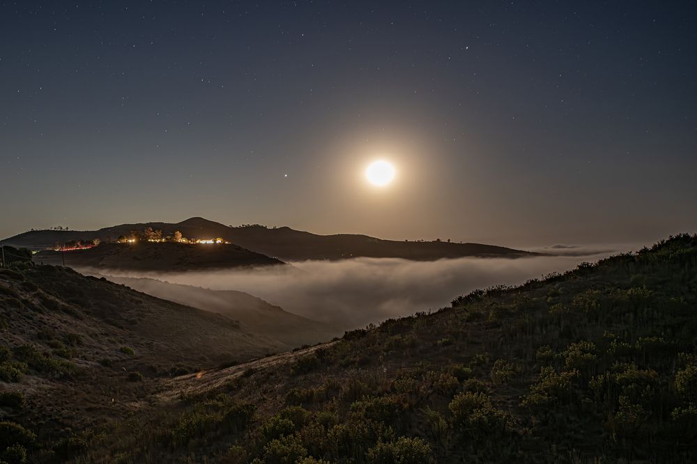 Moon’s Embrace over the Valley of Clouds
