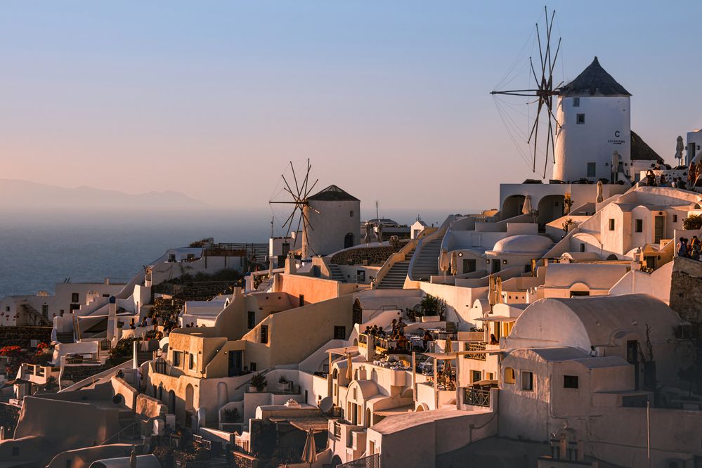 Sunset glow over Oia windmils