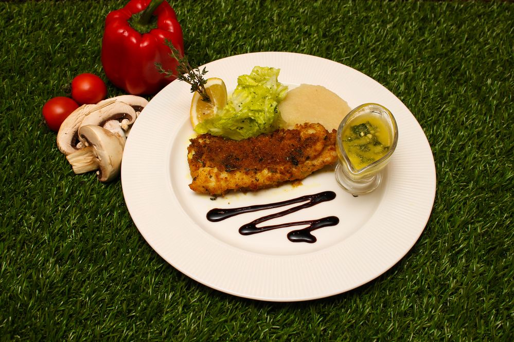 Baked meat with lemon and sauce