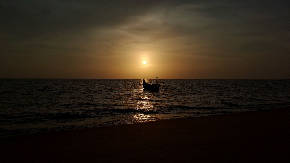 Beautiful Sunset and Fishing Boat
