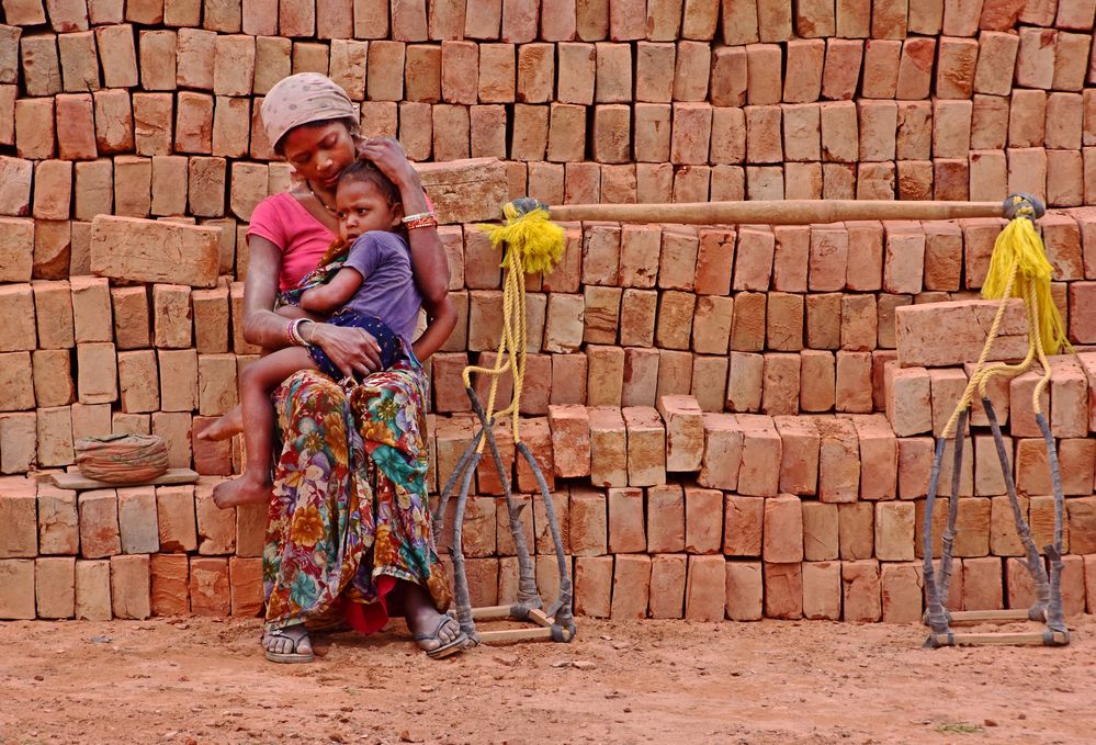 A POOR MOTHER WITH HER CHILD