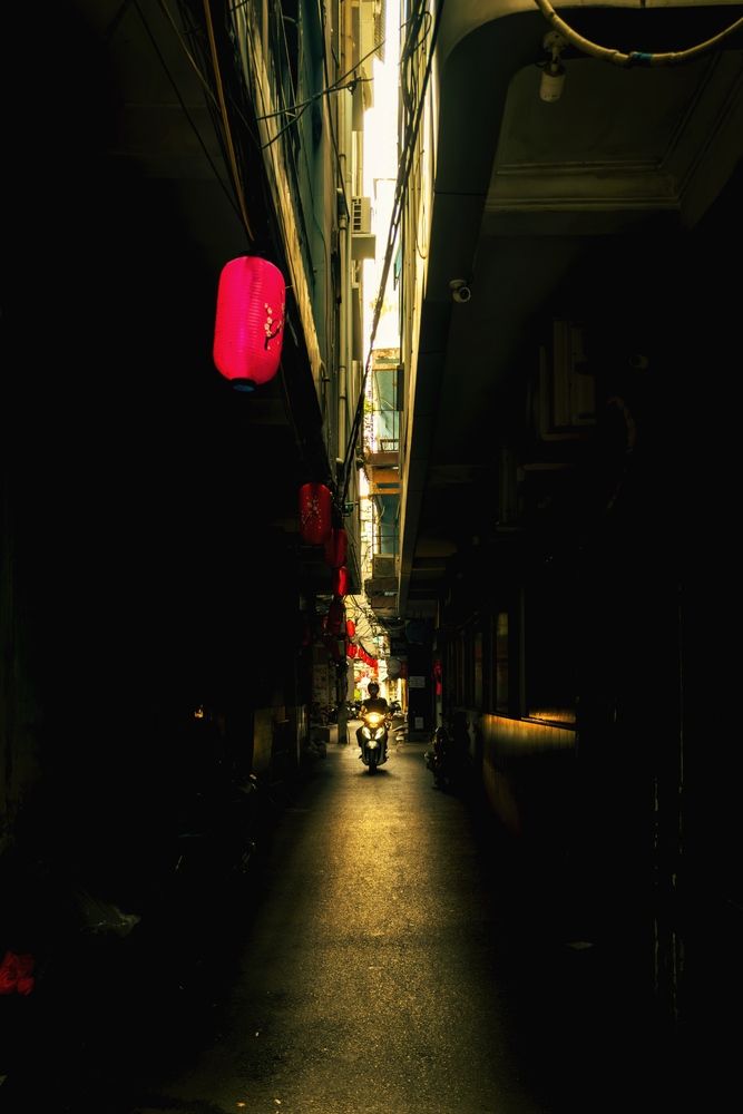 “Slipping through the typical alley in Saigon”