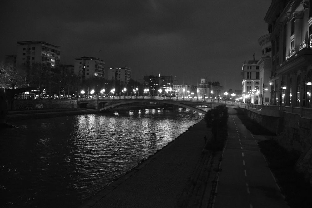 Macedonia, Skopje, River Vardar at night.