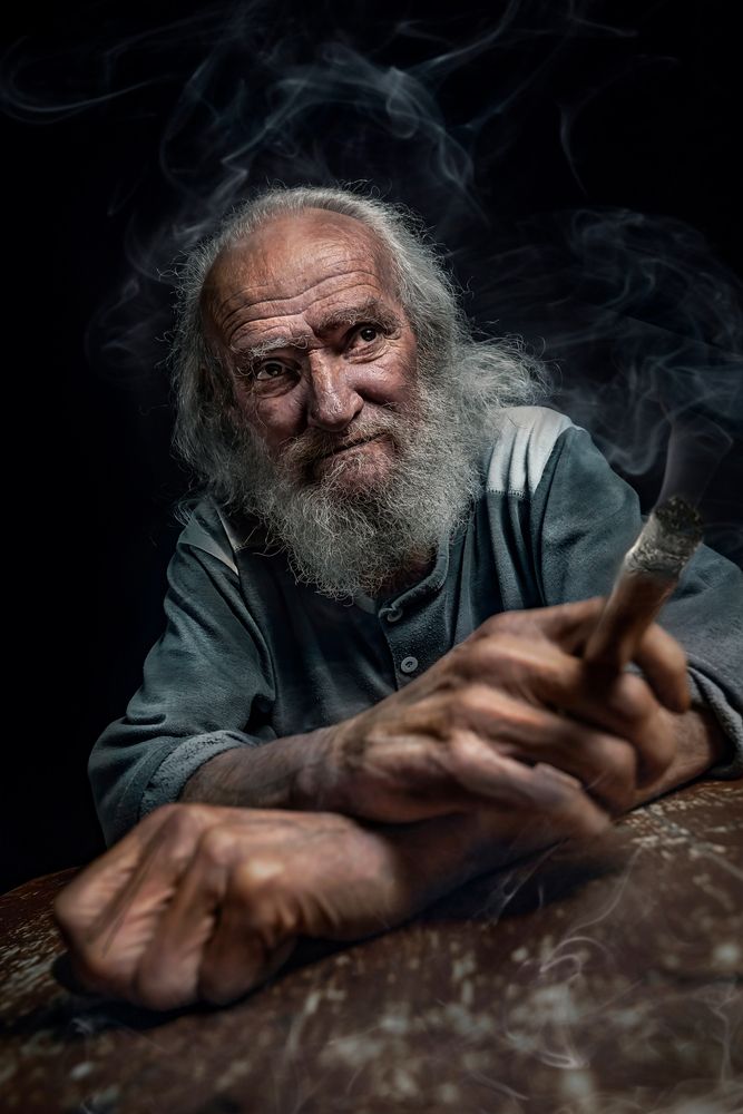 Old man smoking a cigar