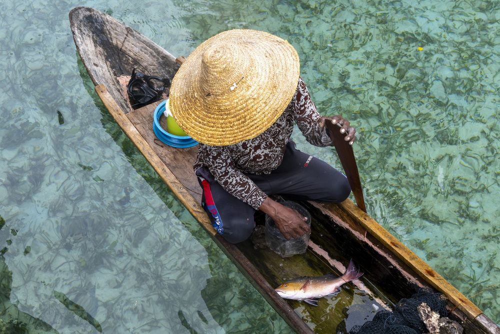 Man selling the fish, Borneo