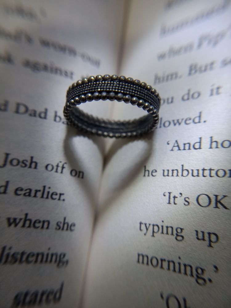 Heart-Shaped Shadow Over Open Book