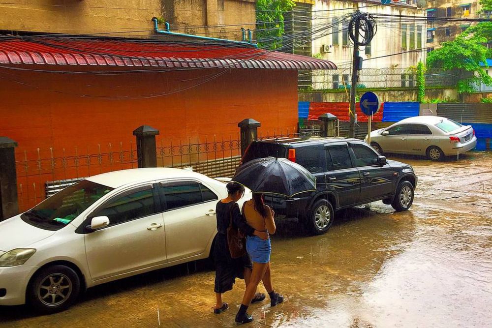 Ladies Walking In Rainy Day