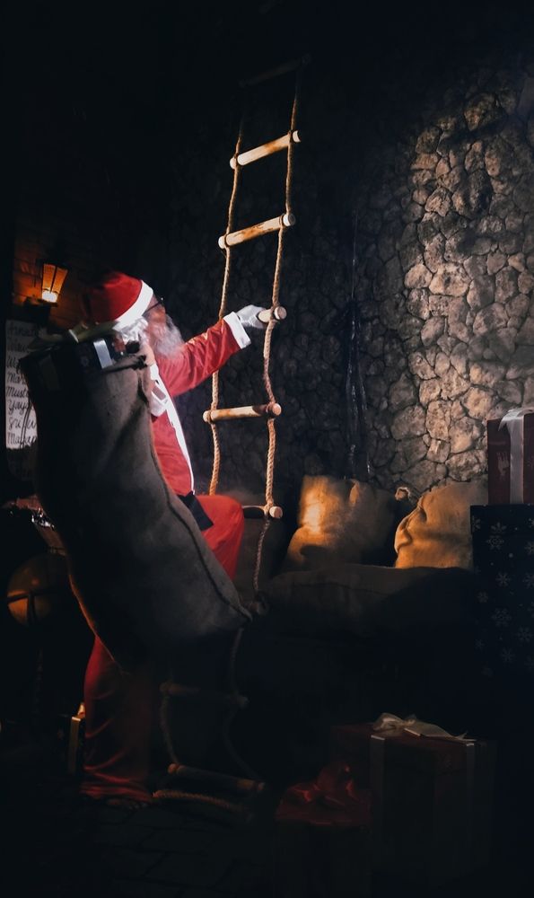Santa Claus climbs a rope ladder