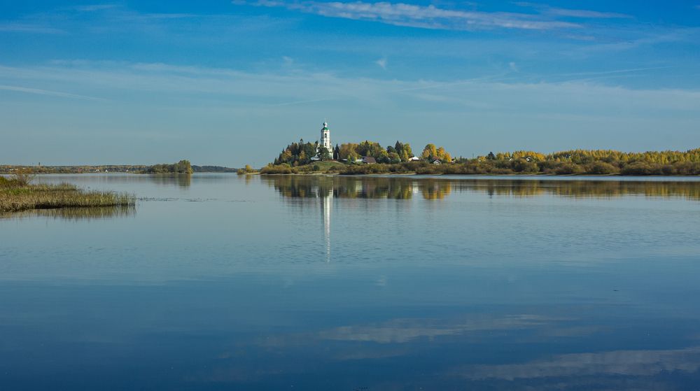 The Church of Athanasius the Great in the distance near the Kubena River on an autumn day