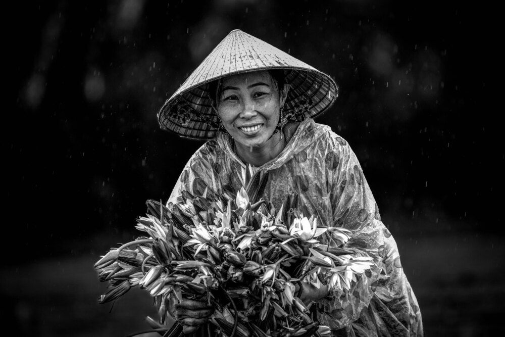 Girl picking water lilies in the rain