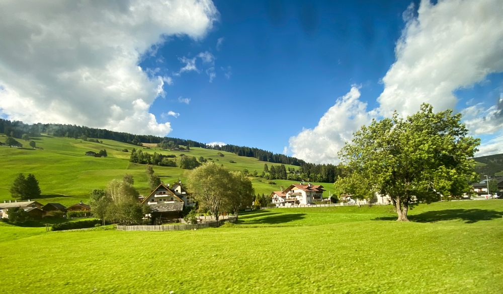 Clouds over a green plain