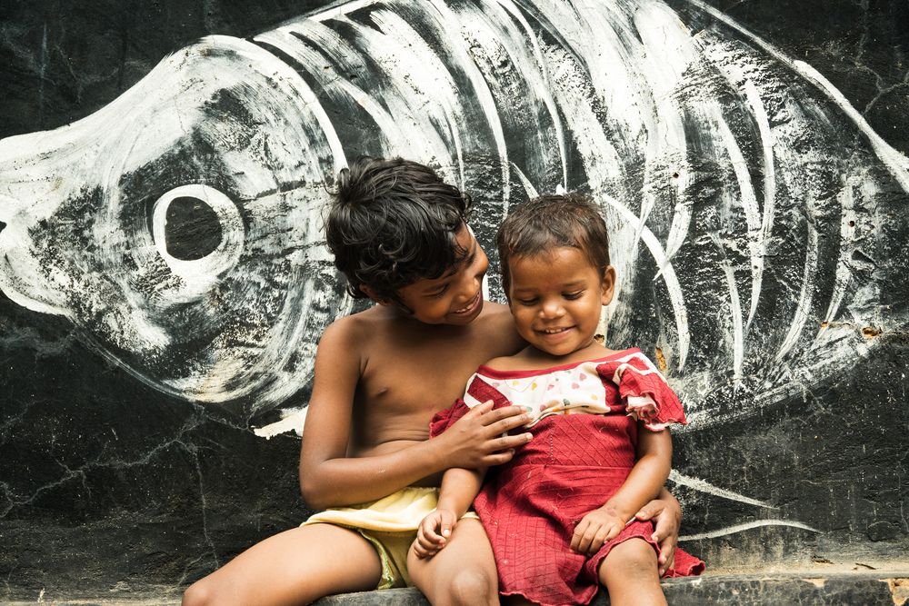 Small hands, shared warmth, life flows