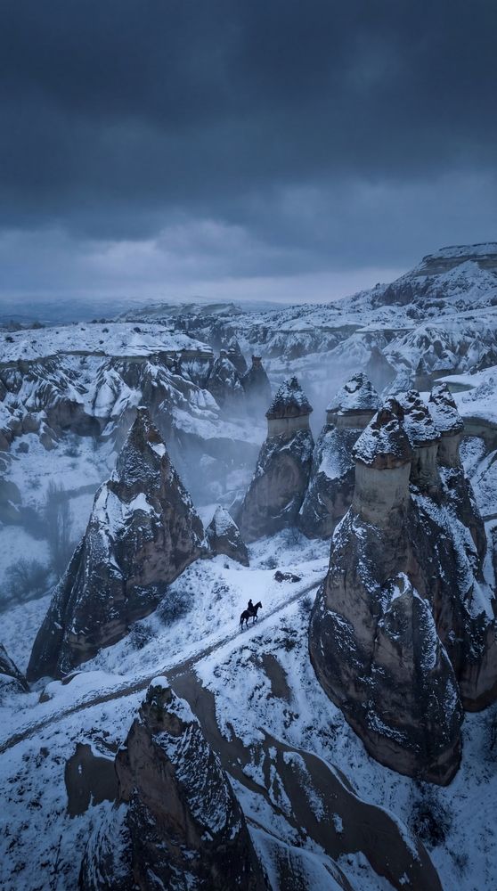 A horseman in snowy Cappadocia
