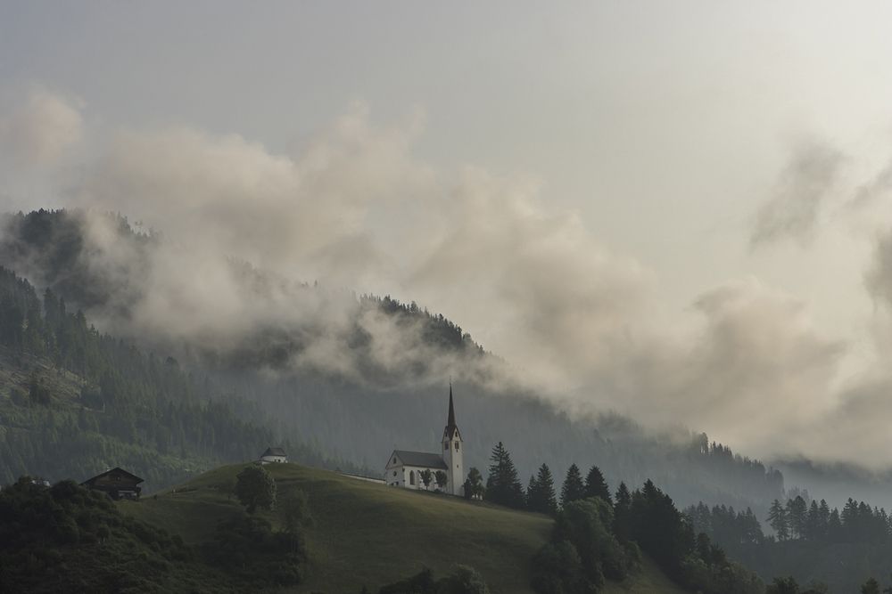 Under the rising clouds