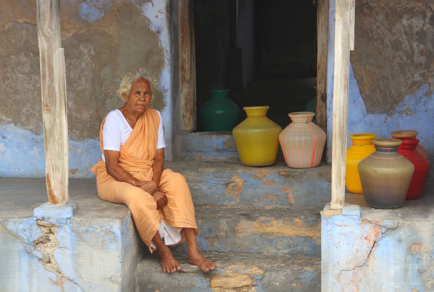Old woman waiting for water