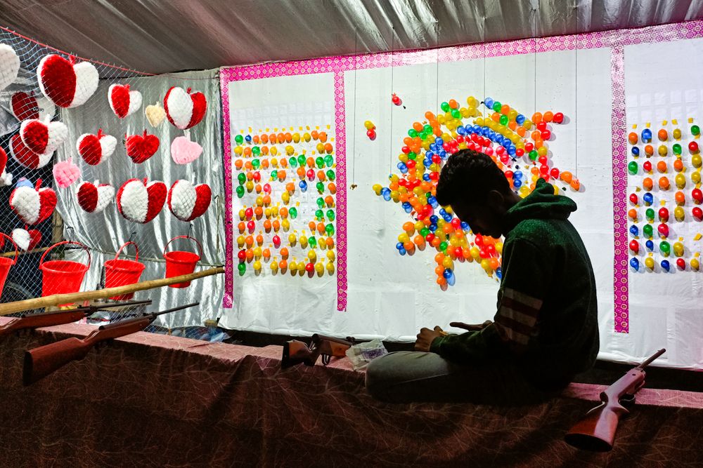 Clarity of Life at a Traveling Fair Through a Shopkeeper’s Silhouette Waiting for Customers