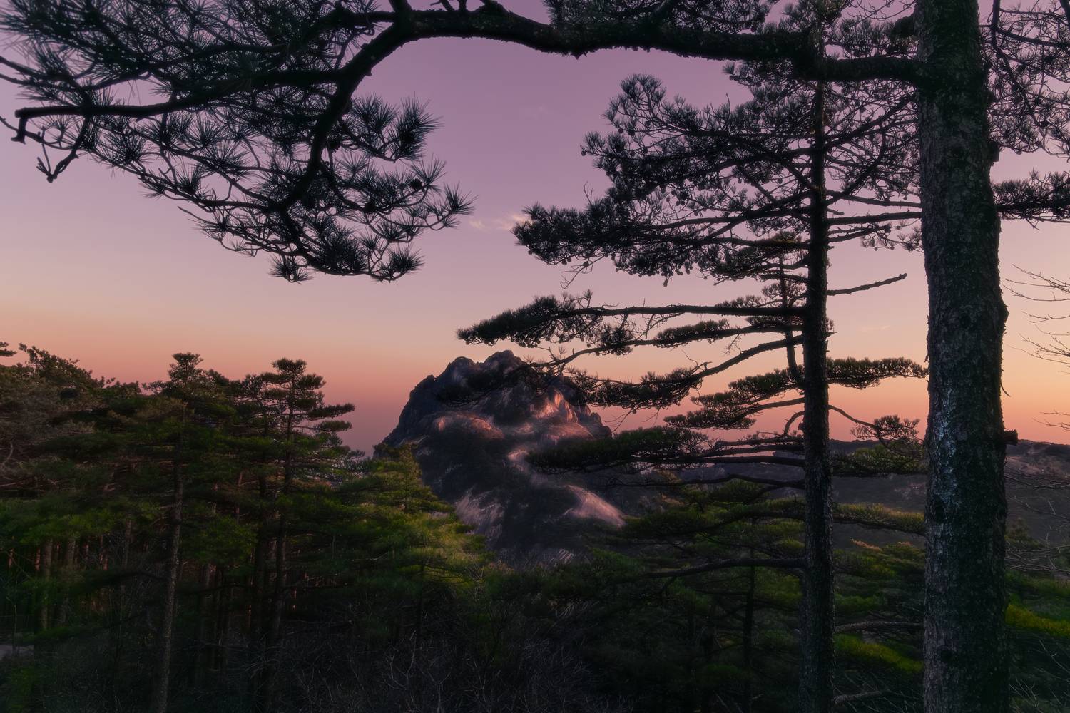 Twilight dyes the mountain peaks