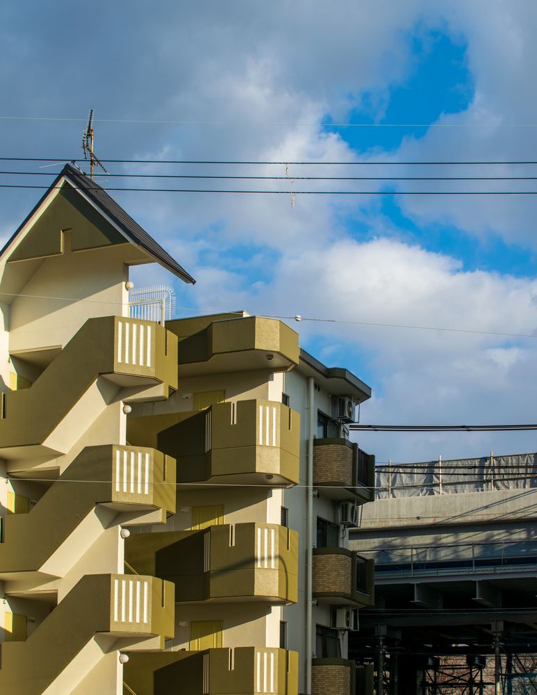 Urban Layers Under Blue Sky
